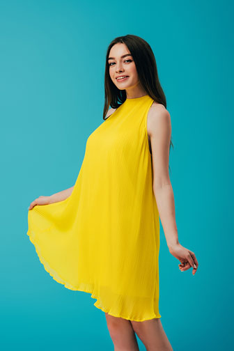 young woman wearing a yellow dress